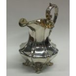 A large good quality cast silver cream jug with gi