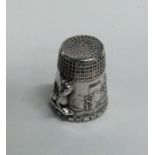 A chased silver thimble decorated with animals. Ap