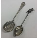 An unusual silver teaspoon mounted with a kookabur
