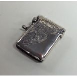 A silver engraved vesta case decorated with flower