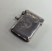 A silver engraved vesta case decorated with flower