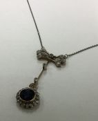 An attractive Victorian sapphire and diamond penda