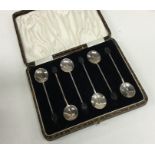 A boxed set of six silver bean top coffee spoons.