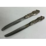 A pair of Chinese silver knives, the handles decor