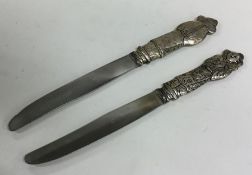 A pair of Chinese silver knives, the handles decor