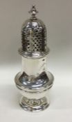 A massive baluster shaped silver sugar caster with