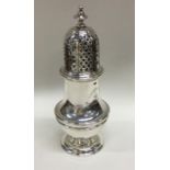 A massive baluster shaped silver sugar caster with