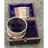 A boxed pair of bright cut silver napkin rings. Sh