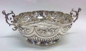 A Victorian silver half fluted bowl with floral de