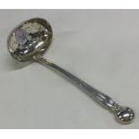 A silver pierced sifter ladle with fluted handle.