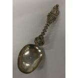 A silver spoon attractively decorated with figures