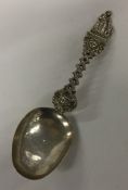 A silver spoon attractively decorated with figures