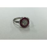 An attractive ruby and diamond circular cluster ri