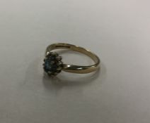 A 9 carat cluster ring. Approx. 2.1 grams. Est. £2