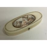 An attractive oval gold and ivory box with waterco