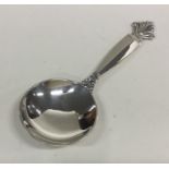 GEORG JENSEN: A stylish silver caddy spoon of text