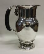 GEORG JENSEN: A massive silver ewer / pitcher attr