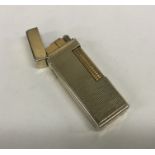 An engine turned gold plated Dunhill lighter. Appr