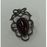 An unusual Antique pendant with central cabochon g