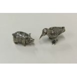 Two novelty silver figures with textured bodies. A