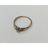 A 9 carat yellow gold diamond single stone ring in