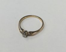 A 9 carat yellow gold diamond single stone ring in