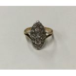 A diamond marquise shaped cluster ring in two colo