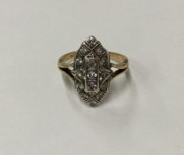 A diamond marquise shaped cluster ring in two colo