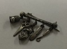 A novelty silver brooch in the form of a sewing co