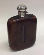 A large silver and leather mounted hip flask with