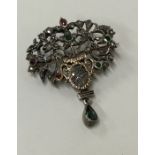 An early gold rose diamond and emerald brooch deco