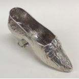 A large Victorian model of a shoe of textured form