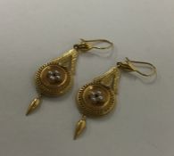 A pair of Antique high carat gold drop earrings en