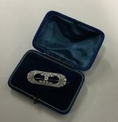 An Art Deco platinum and diamond brooch with openw