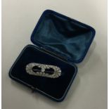 An Art Deco platinum and diamond brooch with openw