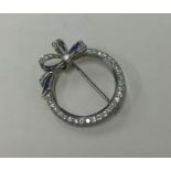An attractive sapphire and diamond bow brooch of c