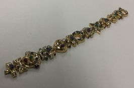 A French multi gem set 18 carat yellow gold bracel