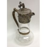 A Victorian silver lemonade jug decorated with cre