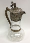 A Victorian silver lemonade jug decorated with cre