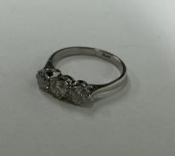 A good diamond three stone ring in claw mount. App