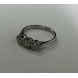 A good diamond three stone ring in claw mount. App