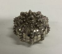 A circular Islamic silver hinged top box on pedest