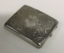 An attractively engraved silver cigarette case. Bi