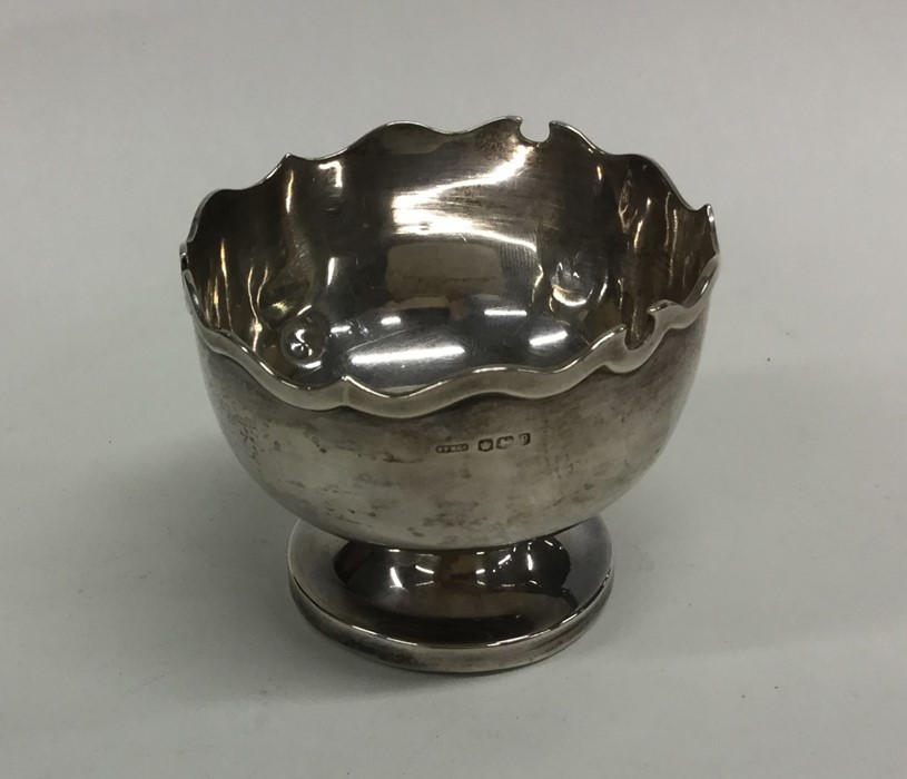 An Edwardian silver bonbon dish with shaped edge.