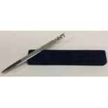 A heavy silver letter opener in fitted box. London