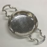 A good Georgian two handled silver lemon strainer