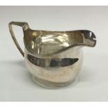 A good Georgian silver cream jug with reeded rim.