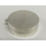 A good quality squat silver pill box with hinged l