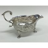 A good quality George II silver cream boat chased