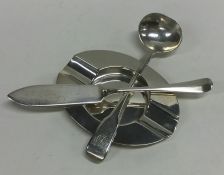 A silver ashtray together with a butter knife etc.